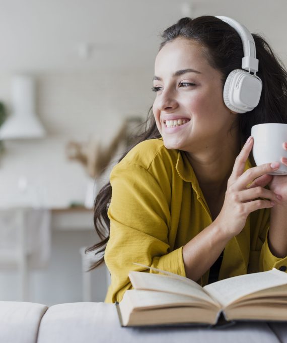 medium-shot-woman-with-headphones-book